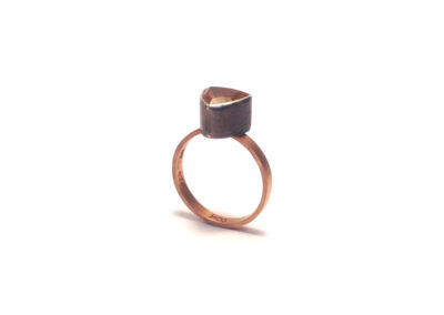 Sunstone-rose-gold-ring-with-oxidized-silver-by-chelsea-jones-3-quarter-view